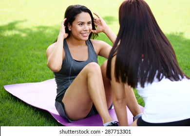 Group Of People Doing A Boot Camp Workout Outside