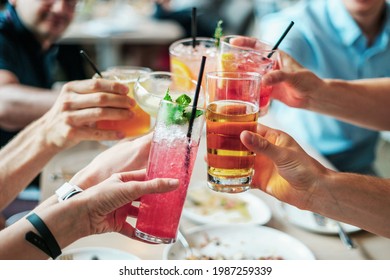 Group of people doing cheers 