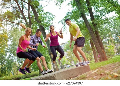 Group Of People Doing A Outdoor Workout In The Park