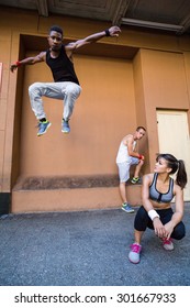 Group Of People Doing Parkour In The City On A Sunny Day