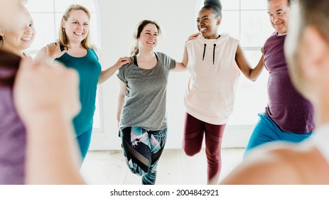 Group of people doing quadriceps stretching