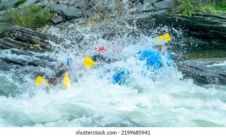 Group Of People Doing Whitewater Rafting In The Pure Nature Of Scandinavia