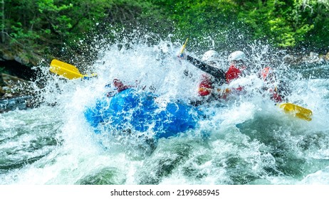 Group of people doing whitewater rafting in the pure nature of Scandinavia