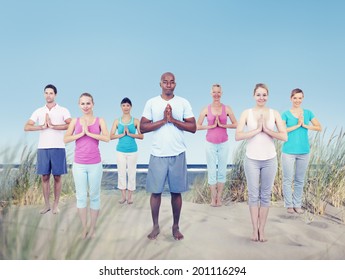 Group Of People Doing Yoga At Beach