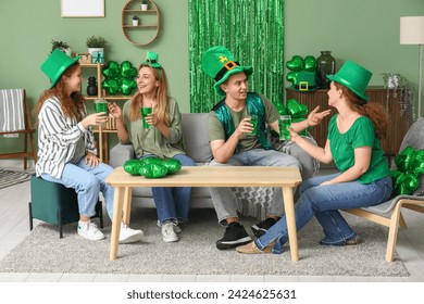Group of people drinking beer at home on St. Patrick's Day - Powered by Shutterstock