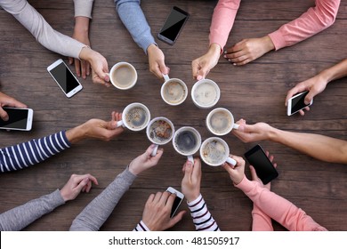 Group Of People Drinking Coffee Together