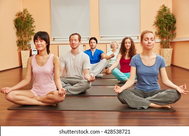 Group Of People During Yoga Meditation Breathing Exercise Class