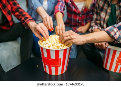 Group Of People Eating Popcorn In Cinema