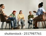 Group of people engaging in group therapy session led by therapist sitting in circle in cozy room with relaxed atmosphere, discussing personal issues and seeking support from each other