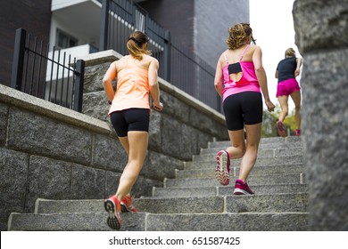 A Group Of People Enjoying In The Fitness Having Fun Running Outside