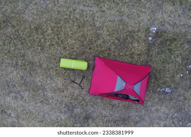 Group of people enjoying tent camping in mountains (aerial view, car not recognizable) - Powered by Shutterstock