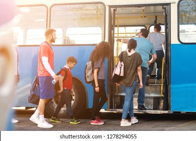 Group Of People Entering Public Transportation.