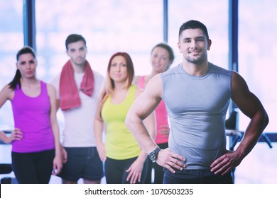 Group of people exercising at the gym and stretching - Shutterstock ID 1070503235