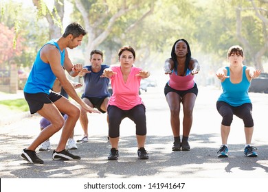 Group Of People Exercising Street With Personal Trainer - Powered by Shutterstock