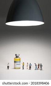 Group Of People (figurine) Standing Near The Coronavirus COVID-19 Vaccine With Black Ceiling Lamp.Concept Background For Innovation,the Power Of Creativity, New Life,healthcare And Medical.