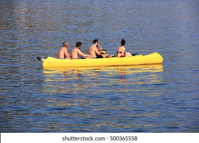 a group of people float on an inflatable rubber boat