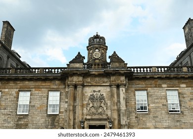 A group of people in front of brick building with clock - Powered by Shutterstock
