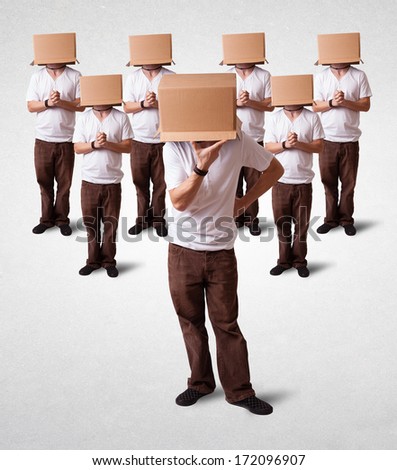 Group of people gesturing with empty box on their head