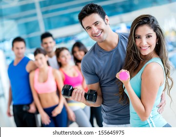 Group of people at the gym looking very happy 