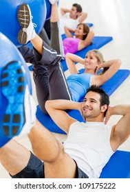 Group Of People At The Gym In A Pilates Class