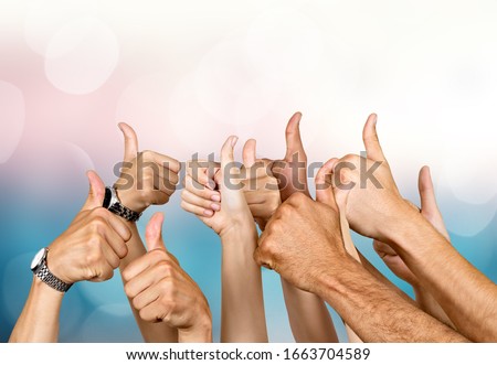 Group of people hands showing thumbs up signs