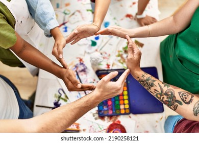 Group of people with hands together art studio. - Powered by Shutterstock