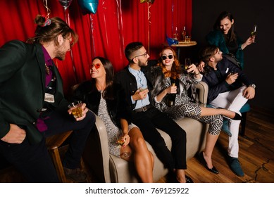 Group of people having a small talk at a party