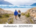 A group of people are heading towards the Perito Moreno glacier to carry out the mini trekking.