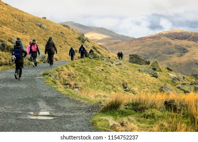 Group Of People Hiking To Snowdon Mountain In Snowdonia National Park