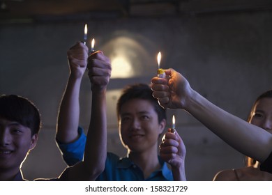 Group Of People Holding Cigarette Lighters At  Concert