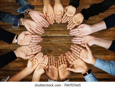 Group of people holding hand assemble together in aerial view