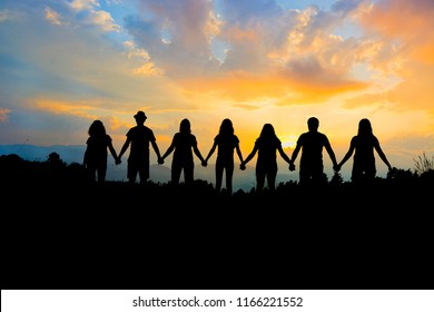 Group of people holding hands team unity