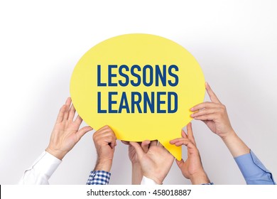 Group of people holding the LESSONS LEARNED written speech bubble