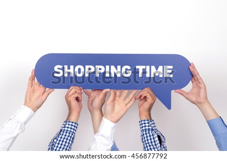 Group of people holding the SHOPPING TIME written speech bubble