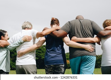 Group People Hugging Park Stock Photo 1242876331 | Shutterstock