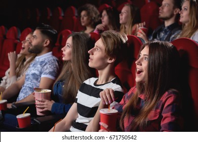 Group Of People Looking Excited While Watching A Movie At The Cinema Audience Lifestyle Leisure Happiness Emotions Shocked Surprised Amused Concept.