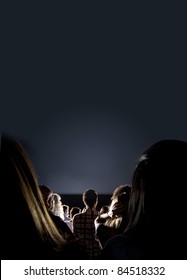 Group Of People Looking At The Screen At The Cinema