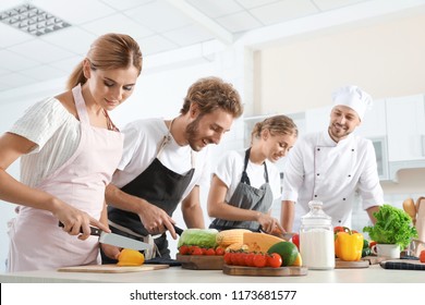 Group Of People And Male Chef At Cooking Classes