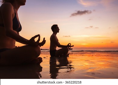 Group Of People Meditating On The Beach, Yoga And Health Background