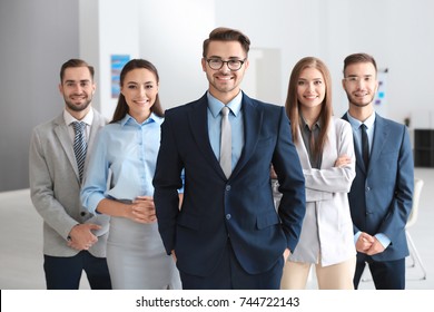 Group of people in office - Shutterstock ID 744722143