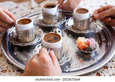 Group Of People On The Hands Drinking Turkish Coffey, Top View