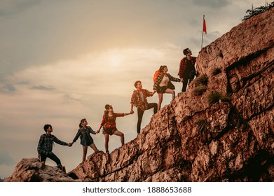 Group Of People On Peak Mountain Climbing Helping Teamwork , Travel Trekking Success Business Concept.