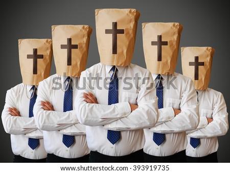 Group of people with a paper bag with the cross on it