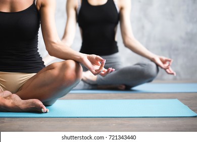 Group People Practicing Yoga Indoors. Close Up Hands In Meditating Gesture. Copy Space.