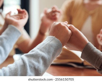 group of people praying together while holding hand on holy bible book at church. Concept of hope, religion, faith, christianity and god blessing. - Powered by Shutterstock