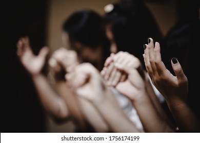 Group of people praying worship believe. soft focus, praying and praise together at home. devotional or prayer meeting concept.