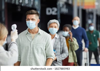 Group Of People In Protective Masks Are Being Tested Standing On The Street Outdoors