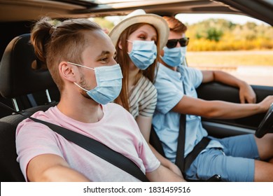 group of people riding in car with medical mask
