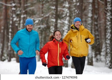 Group Of People Running In Winter