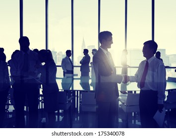Group of People Shaking Hands at New York Skyline - Powered by Shutterstock